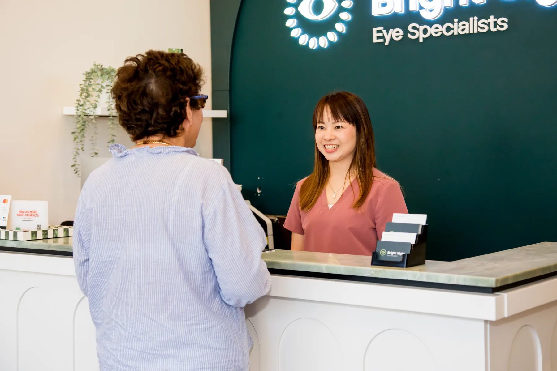 A patient being welcomed at Bright Sight Eye Specialists